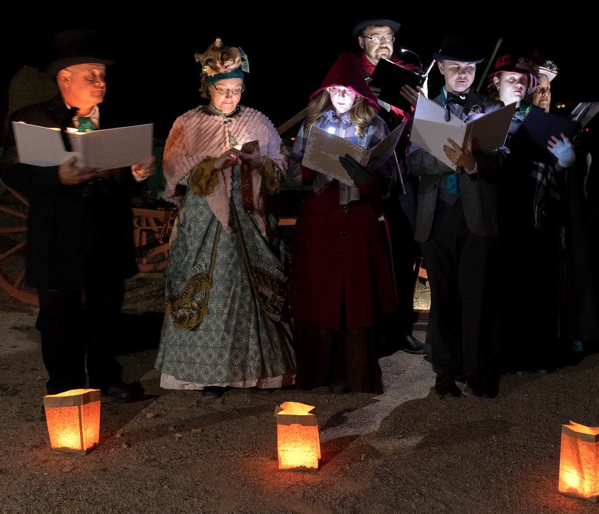 Carolers sing at Fort Selden during 2019's Las Noches de Las Luminarias.