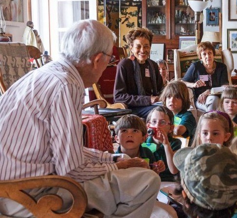 J. Paul Taylor visits with students from the J. Paul Taylor Academy in 2012 during a school tour of the home.