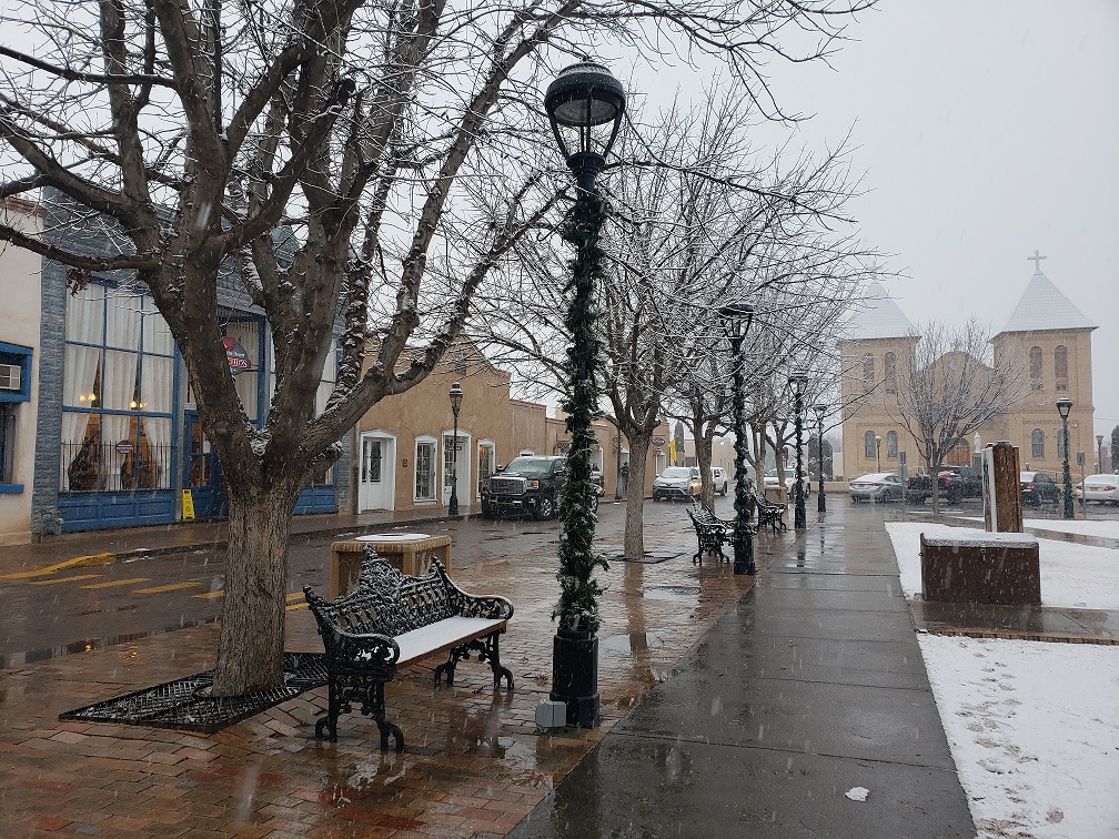 Snow falls on the Mesilla Plaza.