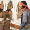 5th grade students examining Apache Scout mannequin.
